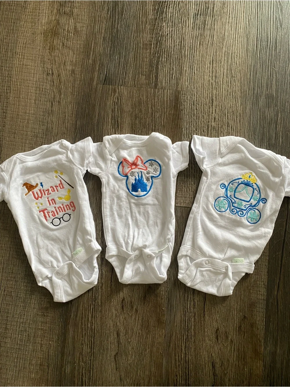 Home embroidered baby bodysuits
